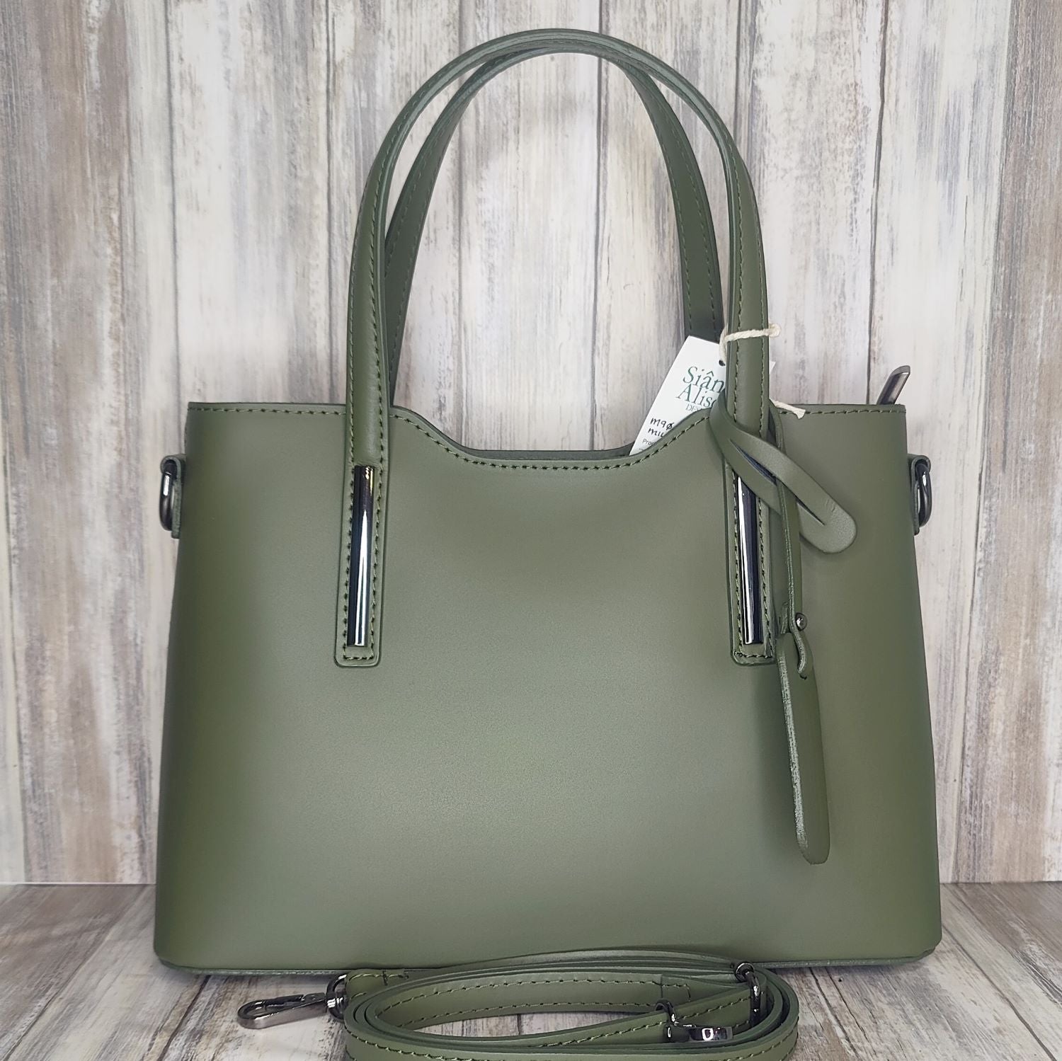 Elevate your style with this stunning Italian leather double compartment handbag.  Its soft yet structured design looks beautiful and feels equally beautiful to wear. This is a classic design that will match with any outfit and is the perfect size for all your essential items. Get ready to make a statement with this fashionable and functional addition to your wardrobe.  We love this bag!