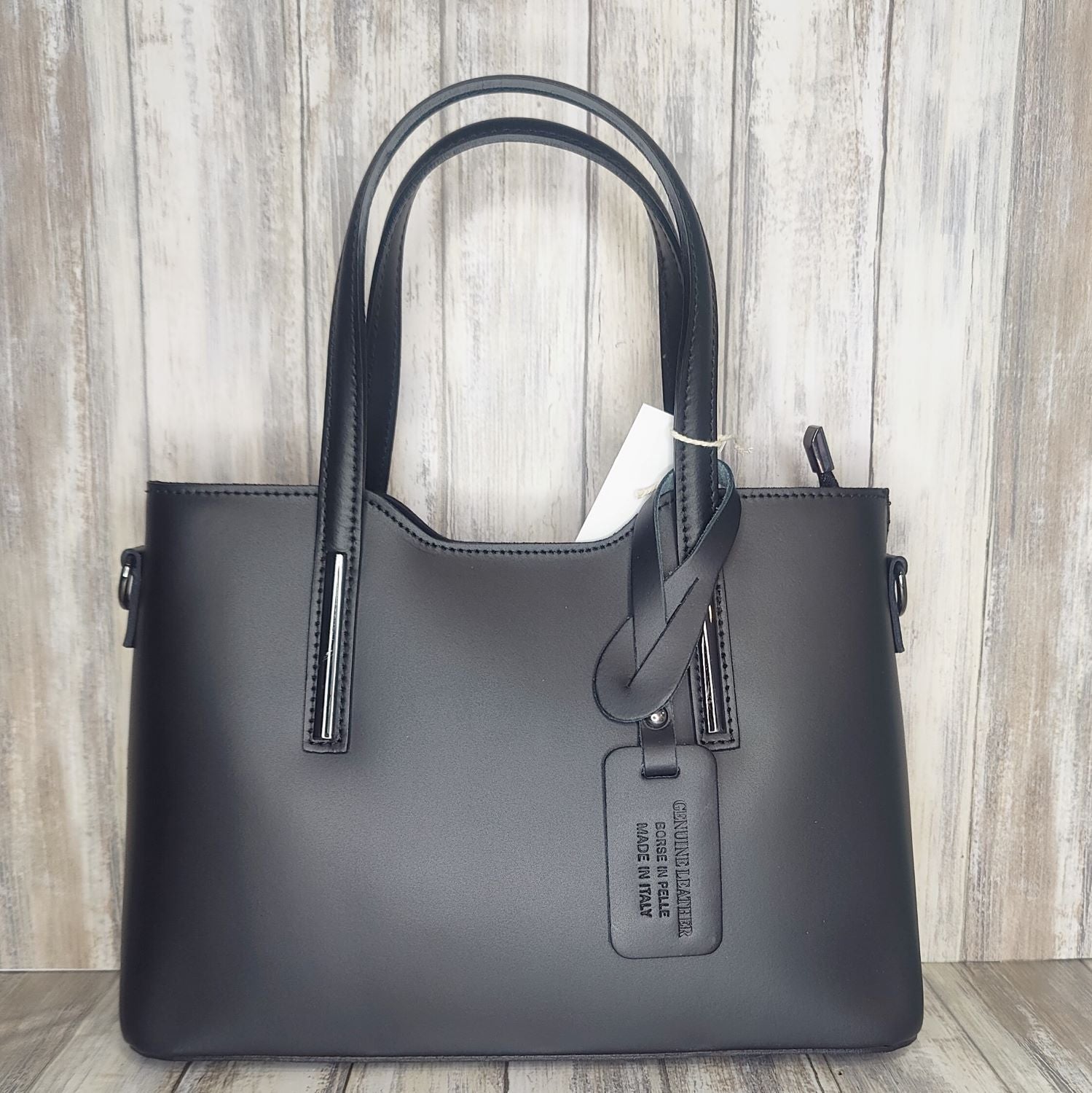 Elevate your style with this stunning Italian leather double compartment handbag.  Its soft yet structured design looks beautiful and feels equally beautiful to wear. This is a classic design that will match with any outfit and is the perfect size for all your essential items. Get ready to make a statement with this fashionable and functional addition to your wardrobe.  We love this bag!