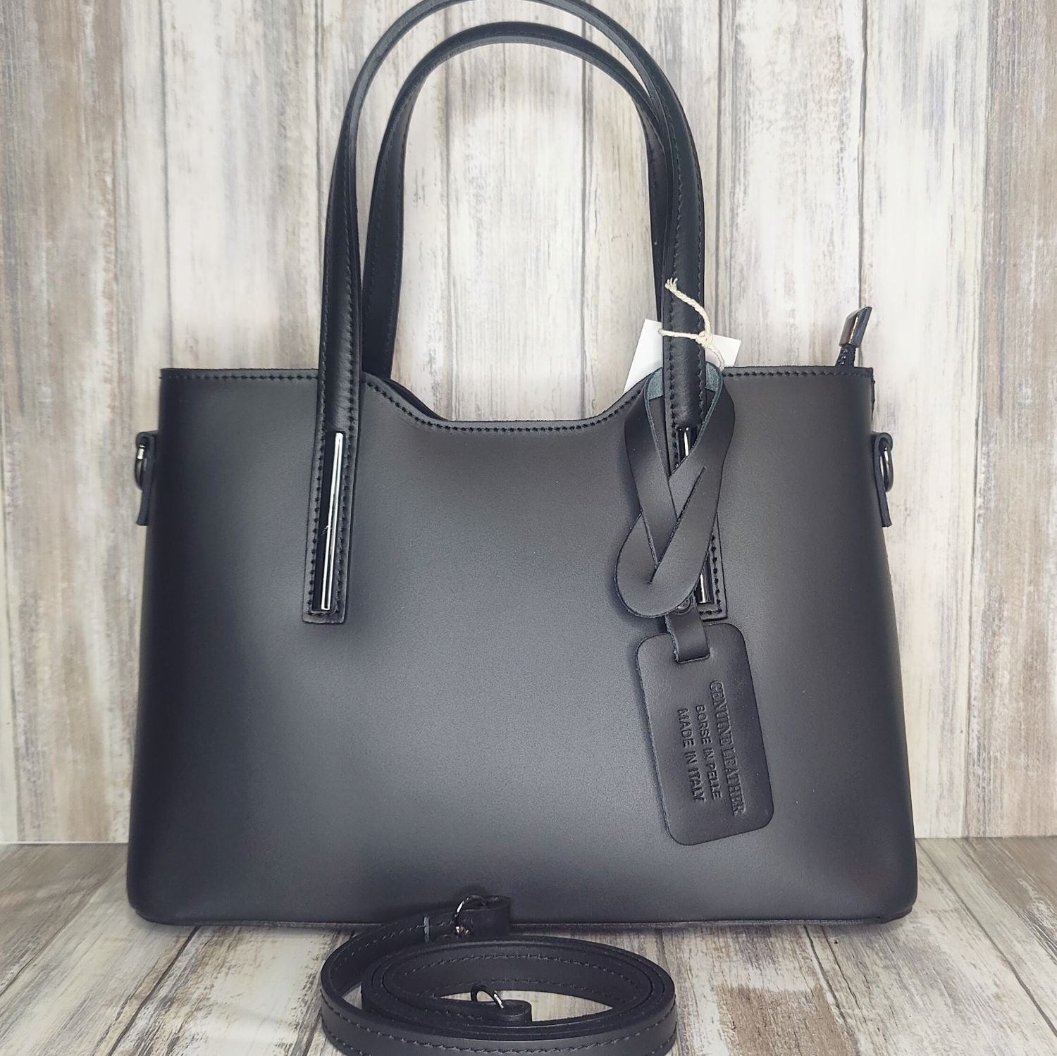 Elevate your style with this stunning Italian leather double compartment handbag.  Its soft yet structured design looks beautiful and feels equally beautiful to wear. This is a classic design that will match with any outfit and is the perfect size for all your essential items. Get ready to make a statement with this fashionable and functional addition to your wardrobe.  We love this bag!