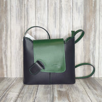 Crafted with Italian leather, this cross body bag features a magnetic dot and zip closure and an adjustable strap for a stylish look.       Back Zip Pocket   Internal Slip Pocket   Silver Hardware   H20cm x W24cm x D6cm