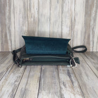 This elegant yet practical saddle bag is crafted from luxuriously soft Italian leather and features a flat silhouette with a postman's lock and zipper closure. The adjustable length strap makes it perfect for carrying as a shoulder bag or cross body.   Outer pocket with zip   Internal zip pocket   Adjustable detachable strap   Silver Hardware   L:23cm x H:16cm x W:4cm