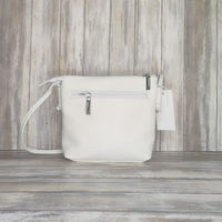 Carry everyday essentials in style with this multi zip Italian leather handbag. Crafted with a soft leather, this cross-body bag features a number of compartments for easy access and an effortlessly chic look. Perfect for bringing style and convenience to your day!  Silver Hardware  l:20CM h:18CM d:6CM