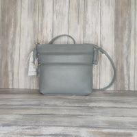 Carry everyday essentials in style with this multi zip Italian leather handbag. Crafted with a soft leather, this cross-body bag features a number of compartments for easy access and an effortlessly chic look. Perfect for bringing style and convenience to your day!  Silver Hardware  l:20CM h:18CM d:6CM