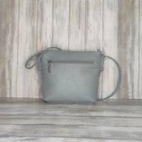 Carry everyday essentials in style with this multi zip Italian leather handbag. Crafted with a soft leather, this cross-body bag features a number of compartments for easy access and an effortlessly chic look. Perfect for bringing style and convenience to your day!  Silver Hardware  l:20CM h:18CM d:6CM