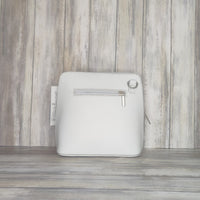 This stylish messenger bag is the ideal companion for your day-to-night looks, featuring detachable straps for easy transitions. Fully lined for convenience, a central zip compartment and an external zip pocket provide ample storage for all your needs.   Silver hardware   Detachable Strap    w:16cm x h:17cm x d: 8cm 