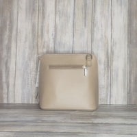 This stylish messenger bag is the ideal companion for your day-to-night looks, featuring detachable straps for easy transitions. Fully lined for convenience, a central zip compartment and an external zip pocket provide ample storage for all your needs.   Silver hardware   Detachable Strap    w:16cm x h:17cm x d: 8cm 