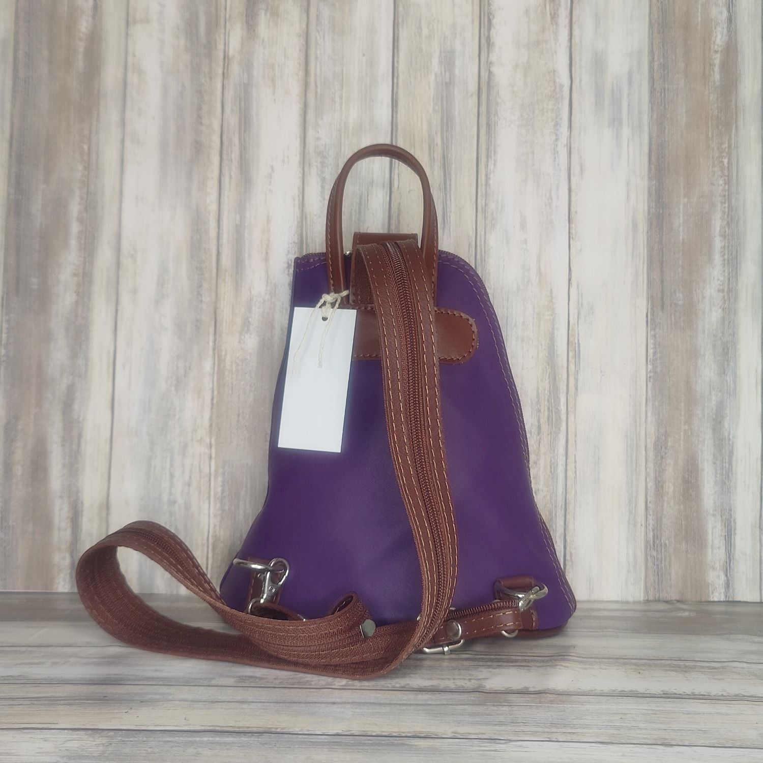 Another beautifully soft and lightweight leather Italian backpack, but this time a smaller version of our large backpack. This small backpack is equally as versatile and can be worn in the same main three ways, either by the loop handle at the top, over one shoulder, or by unzipping the strap and wearing as a classic backpack. You can also unclip the straps of these smaller ones and wear them as a cross body!  Each bag is fully lined with front, back and inside pockets.   w22cm x d23cm x h12cm