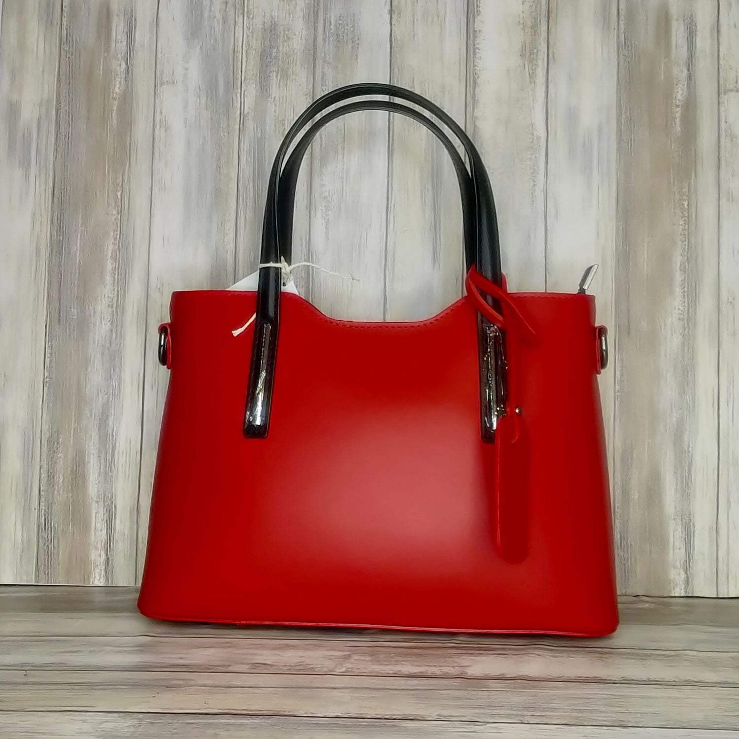 Elevate your style with this stunning Italian leather double compartment handbag.  Its soft yet structured design looks beautiful and feels equally beautiful to wear. This is a classic design that will match with any outfit and is the perfect size for all your essential items. Get ready to make a statement with this fashionable and functional addition to your wardrobe.  We love this bag!