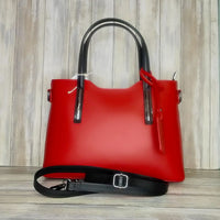 Elevate your style with this stunning Italian leather double compartment handbag.  Its soft yet structured design looks beautiful and feels equally beautiful to wear. This is a classic design that will match with any outfit and is the perfect size for all your essential items. Get ready to make a statement with this fashionable and functional addition to your wardrobe.  We love this bag!