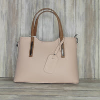 Elevate your style with this stunning Italian leather double compartment handbag.  Its soft yet structured design looks beautiful and feels equally beautiful to wear. This is a classic design that will match with any outfit and is the perfect size for all your essential items. Get ready to make a statement with this fashionable and functional addition to your wardrobe.  We love this bag!