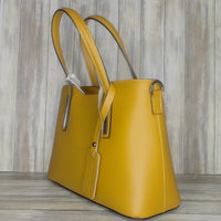 Elevate your style with this stunning Italian leather double compartment handbag.  Its soft yet structured design looks beautiful and feels equally beautiful to wear. This is a classic design that will match with any outfit and is the perfect size for all your essential items. Get ready to make a statement with this fashionable and functional addition to your wardrobe.  We love this bag!