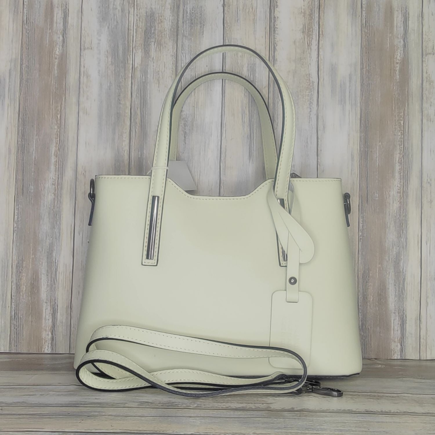 Elevate your style with this stunning Italian leather double compartment handbag.  Its soft yet structured design looks beautiful and feels equally beautiful to wear. This is a classic design that will match with any outfit and is the perfect size for all your essential items. Get ready to make a statement with this fashionable and functional addition to your wardrobe.  We love this bag!