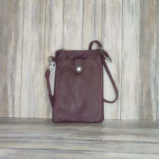 This Italian leather pebbled leather mini bag has it all. It's designed with a phone holder, slick zip closure, and a long cross body detachable and adjustable strap, making it perfect for any occasion. You'll have peace of mind knowing your essentials are safe and secure.  Silver Hardware  Measurement: h21cm x w14cm x d2cm