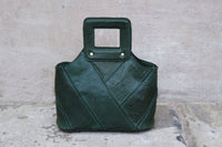 Alizay is a beautiful green leather handbag with an absolutely stunning stitched exterior. The attention to style is reflected in small details such as covering the magnetic closure with a thin layer of leather. The interior is a super soft microfibre lining with slots for cards, lipstick and mobile phone. It also has a zipped pocket for valuables. The bottom of the Alizay bag is studded so you can put her down without worrying about scuffs or damage.  Adjustable leather shoulder strap.