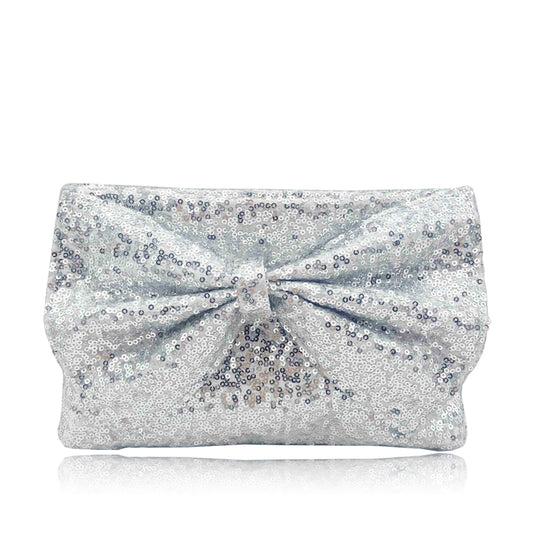 Shine and sparkle with the Ginny Large Bow Glitter Clutch Bag. This stunning and sequinned evening bag features a large bow design, adding an elegant touch to any outfit. With a detachable chain strap and ample room for essentials, this clutch offers both style and practicality. Perfect for a night out, wedding or special occasion.