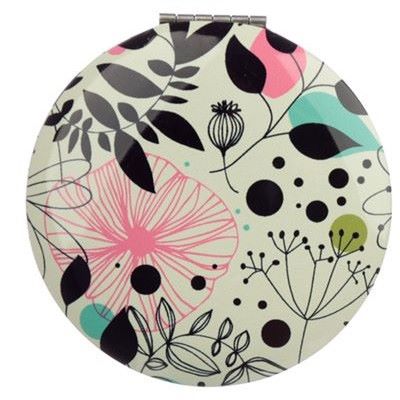 This Botanical Compact Mirror is the perfect choice for when you need to freshen up on-the-go. Featuring two mirrors including one magnifying mirror, all with a stylish wild wood design, this compact is a handbag essential.  H: 6.5cm x W: 6.5cmx D:1cm  Metal and Glass