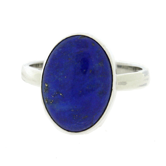 This stunning Oval Cabochon Lapis Lazuli Ring is a semi-precious stone renowned for its intense, deep blue colour. This is a real statement piece, guaranteed to bring you compliments.   The decorative part of the ring measures width 8mm, height 13mm and depth 3mm. The band measures 2mm. All measurements are approximate and measured at widest/longest point.  Delivered gift boxed.