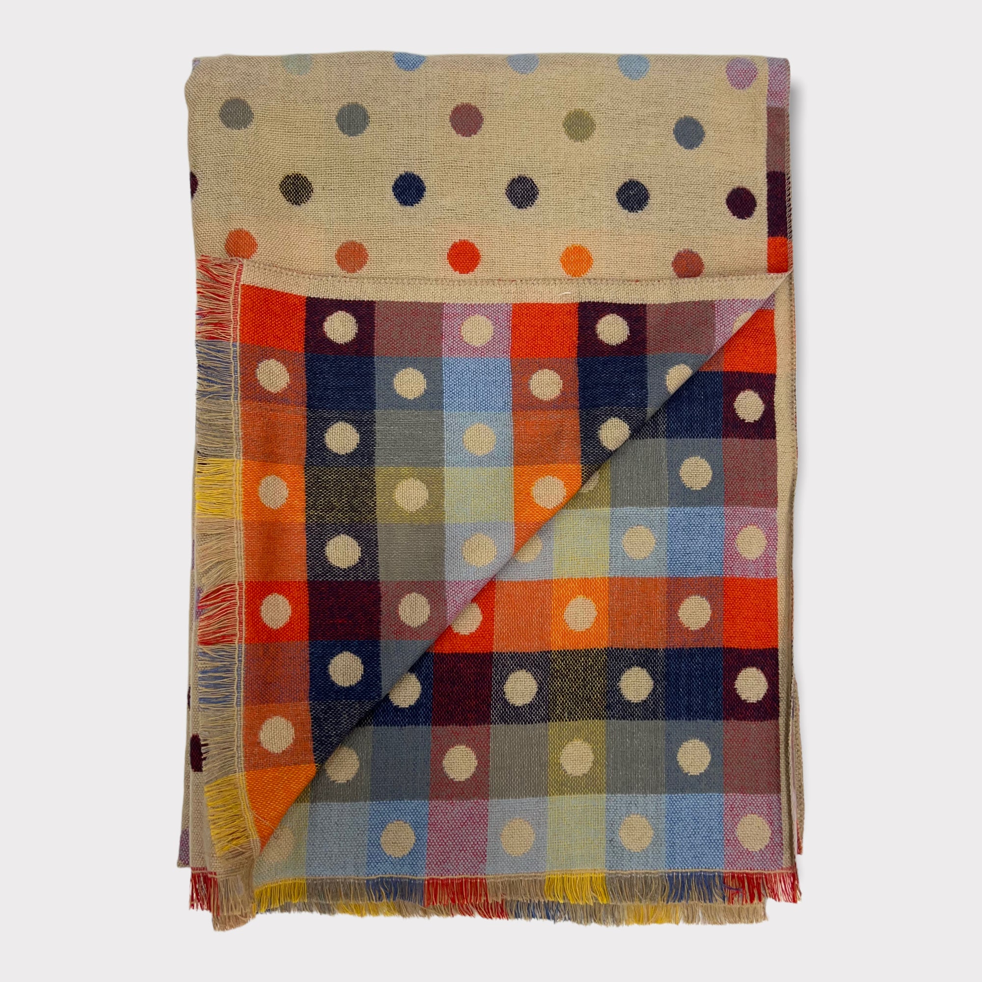 Wrap yourself in the luxury of this reversible  scarf. Its wool blend offers a cosy warmth in the chill of winter, while the multi-coloured dots ensure it stands out in any wardrobe.     180 cm by 65cm   20%Wool and 80% Acrylic