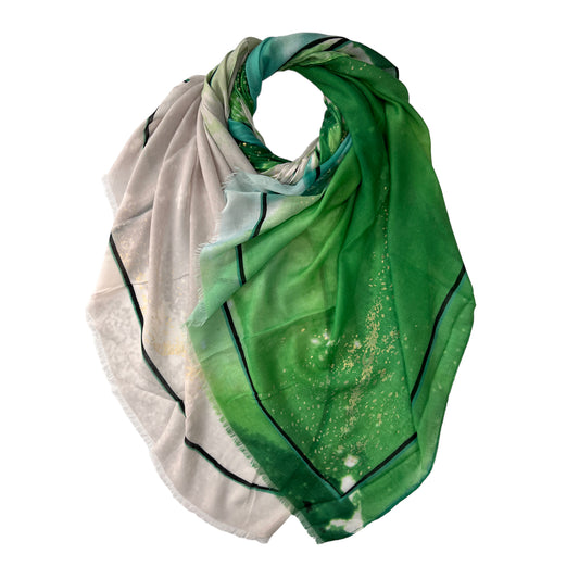 Wrap yourself in luxury with our Ocean Wave Printed Scarf. Featuring a stunning ocean wave print and accented with shimmering silver and gold patches, this scarf is both elegant and eye-catching.
