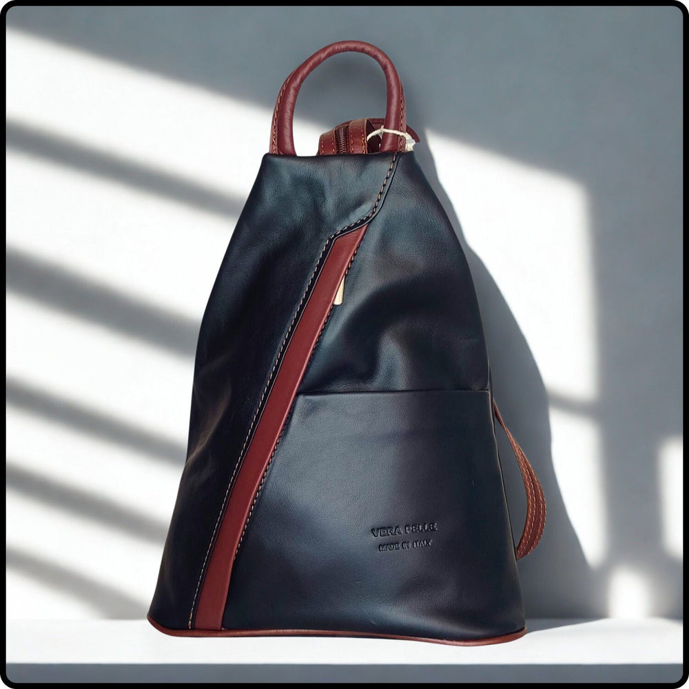 Black backpack with red accents on a light gray background