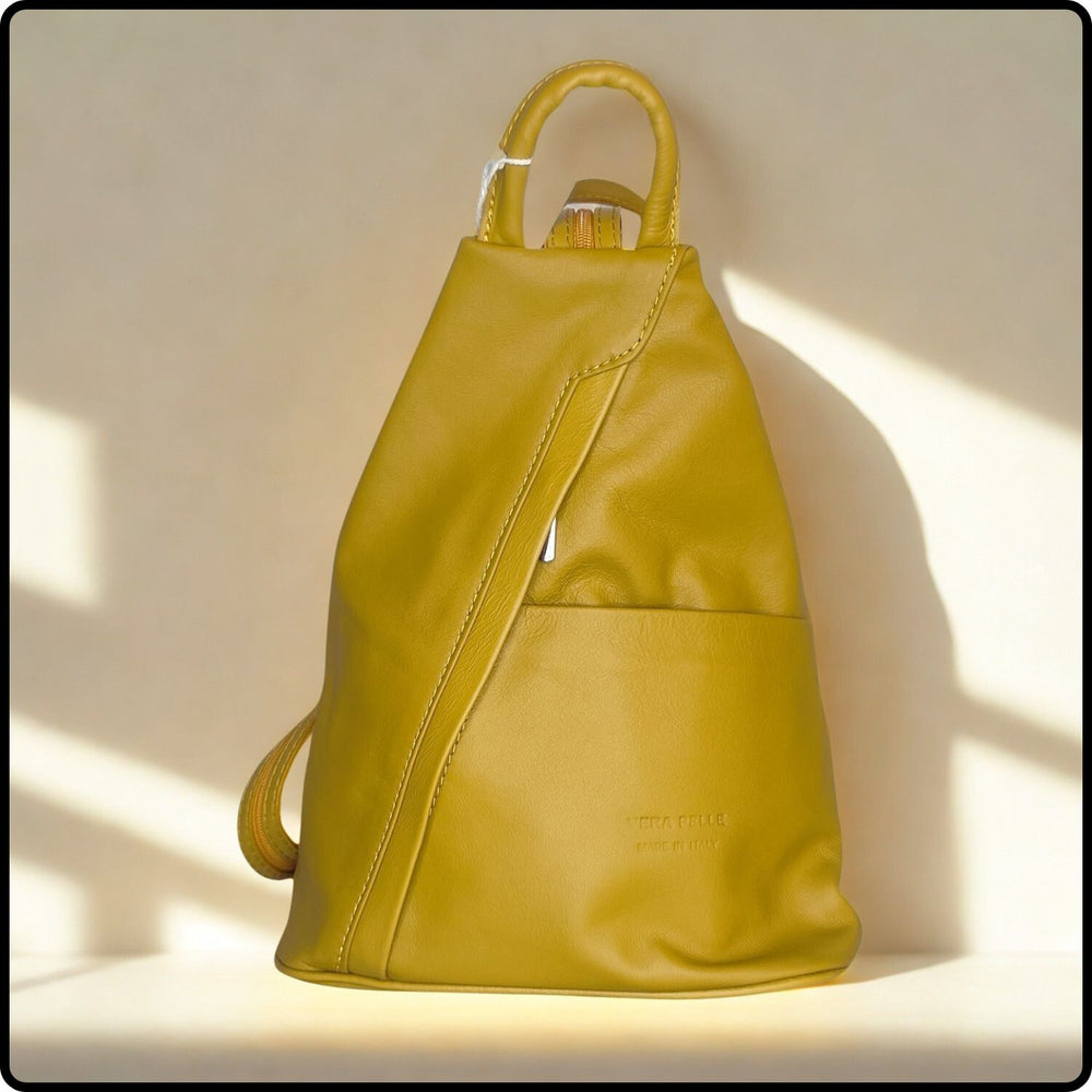 Yellow backpack on a light beige background