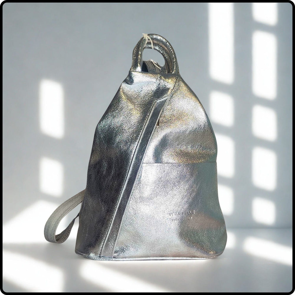 Silver metallic backpack on a light background