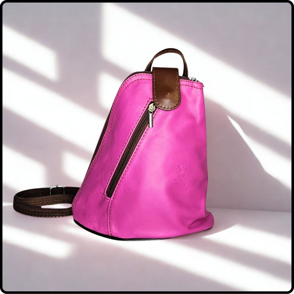 Pink backpack with brown accents on a light background