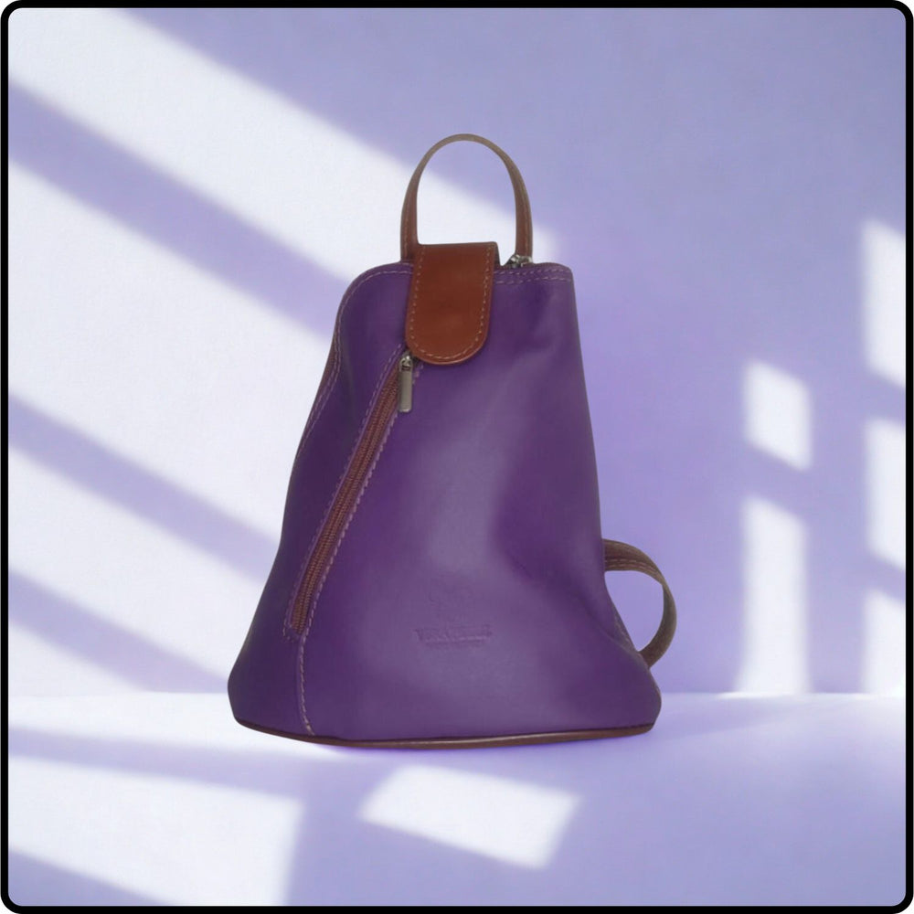 Purple backpack with brown accents on a light purple background