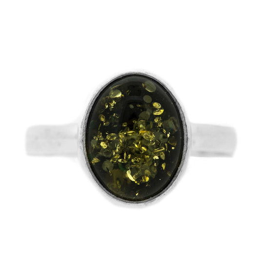 This lovely Oval Green Amber Ring is beautifully crafted in sterling silver and features a simple yet effective design.   The decorative part of the ring measures width 8mm, height 10mm and depth 5mm.The band measures 2mm. All measurements are approximate and measured at widest/longest point.  Delivered gift boxed.