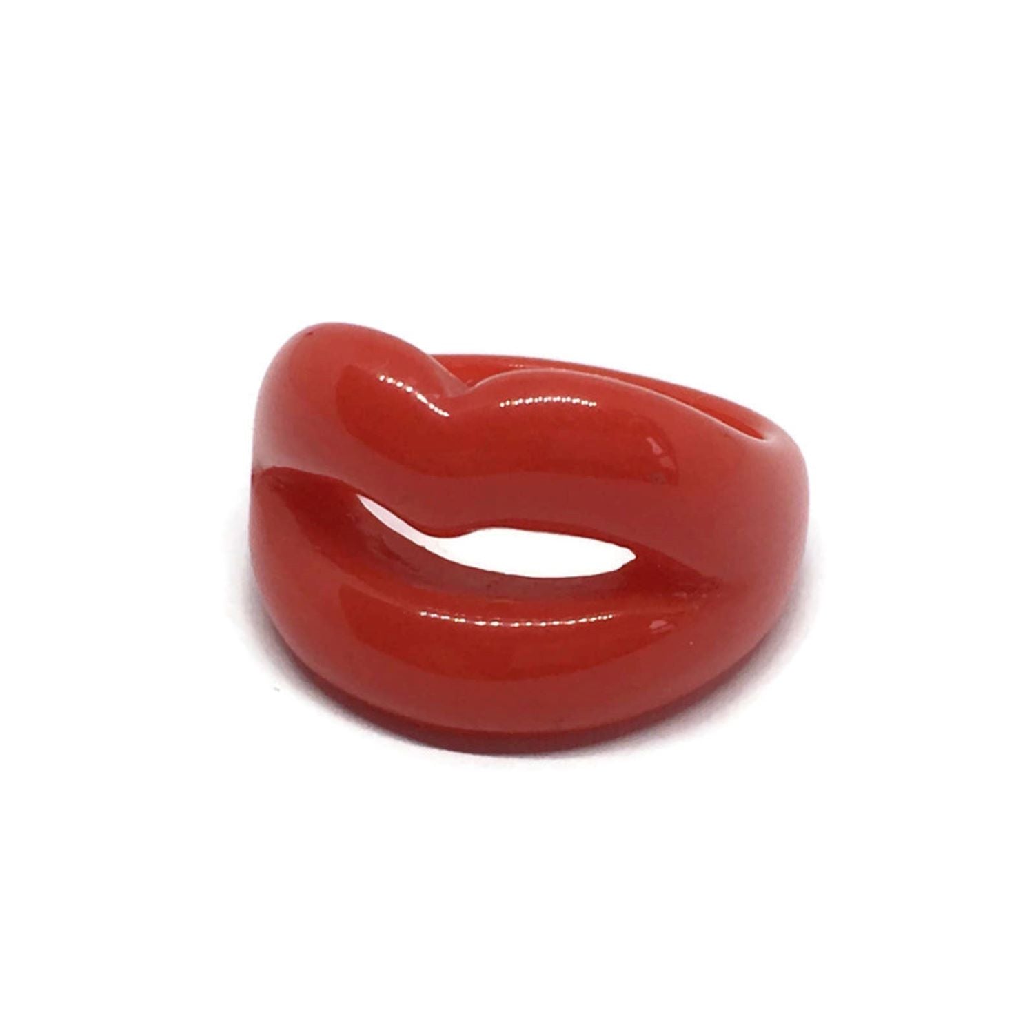 Show off your love of Rocky Horror with the Rocky Horror Resin Lips Ring! The eye-catching red statement design is fun and entertaining, adding a pop of fun to any outfit.   Size N