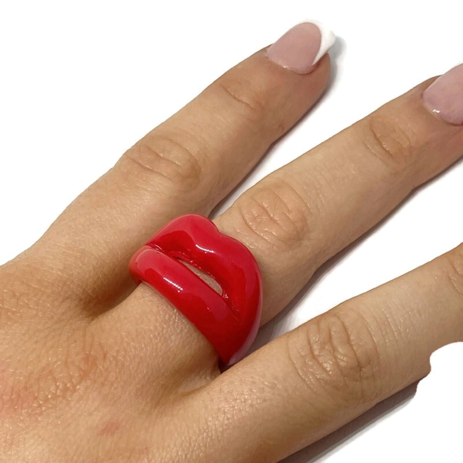 Show off your love of Rocky Horror with the Rocky Horror Resin Lips Ring! The eye-catching red statement design is fun and entertaining, adding a pop of fun to any outfit.   Size N