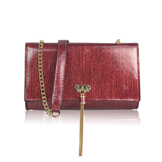 Elevate your evening look with our Arabella bag in a stunning glitter red hue. This sleek and compact bag features a chic metal tassel and a detachable chain strap, offering both practicality and glamour. With sufficient space for all your essentials, this bag is a must-have for any special occasion.