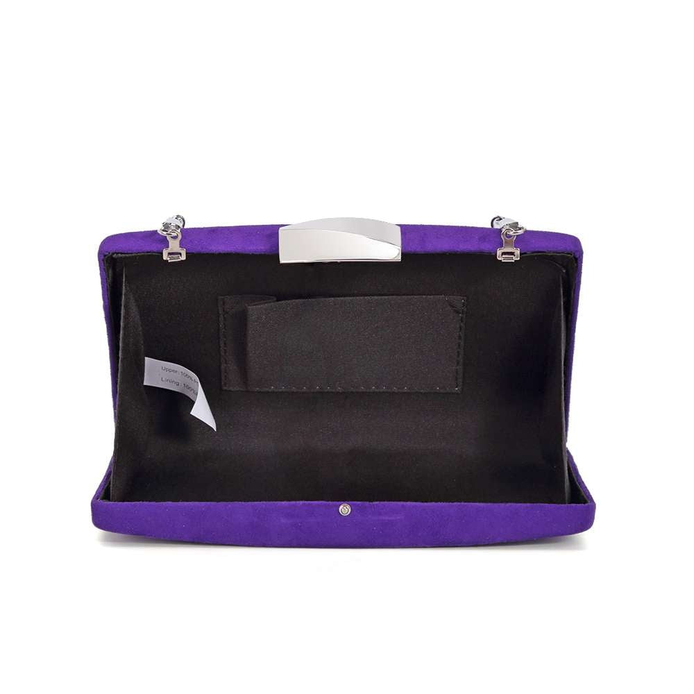 Indulge in luxury with our Ava Evening Bag in stunning purple. The suede effect adds a touch of sophistication to this compact clutch, while the detachable silver chain adds versatility. Make a striking statement at any event with this exclusive piece.