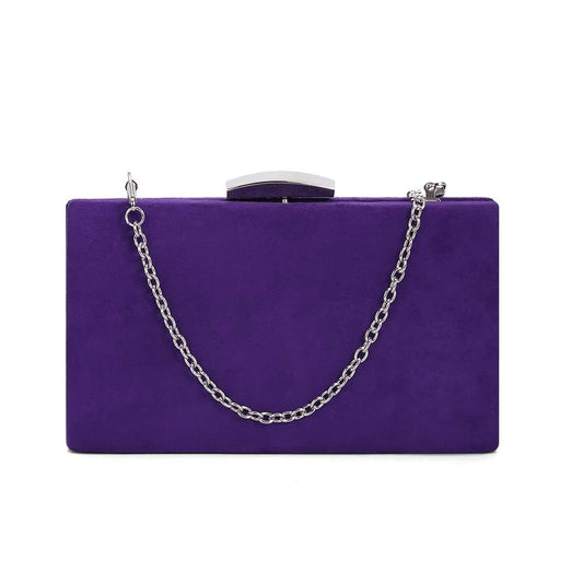 Indulge in luxury with our Ava Evening Bag in stunning purple. The suede effect adds a touch of sophistication to this compact clutch, while the detachable silver chain adds versatility. Make a striking statement at any event with this exclusive piece.